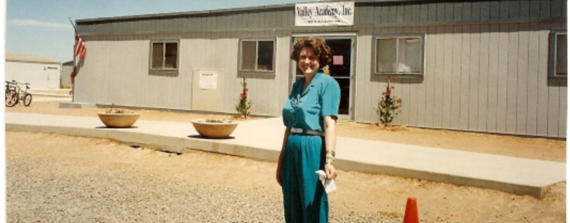 woman in front of valley academy